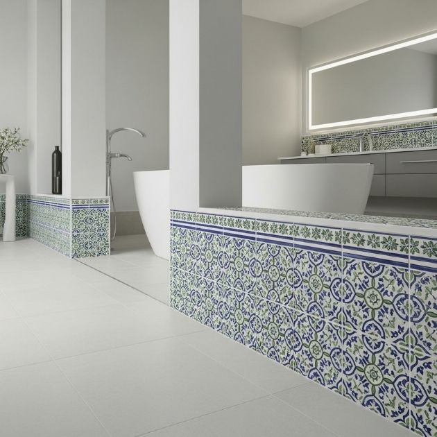 bathroom with decorative edge tile baseboards